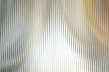 Fototapeta premium A textured background with vertical ribbed patterns that create a sense of depth and abstract visual interest