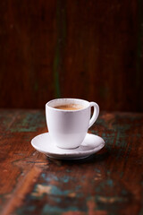 Cup of coffee on wooden background. Soft focus. Copy space