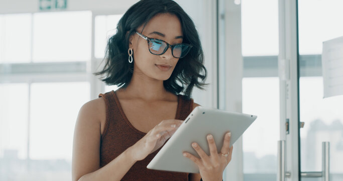 Tablet, glasses and reading with business woman in office for planning, social media marketing and email. Public relations agent, campaign engagement report and app with person in creative agency - Powered by Adobe