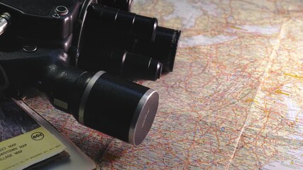 Vintage 8mm camera with travel road maps evoke nostalgic journeys