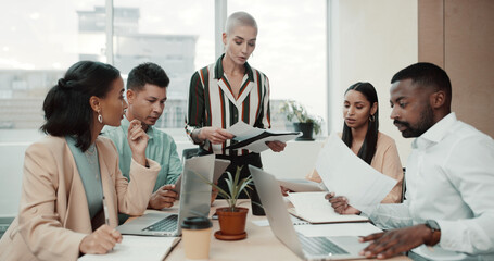 Business people, meeting and document with laptop for collaboration, planning or brainstorming at office. Group of employees, team discussion and technology for paperwork and project management