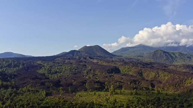 DRONE: SLOW DOLLY OUT SHOT OF THE PARICUTIN VOLCANO, LANDSCAPE AT NOON