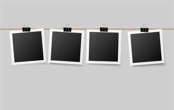 Photographs hanging on a string attached with office clips, cozy decorative concept perfect for personal memory boards, wall displays, or creative layouts.