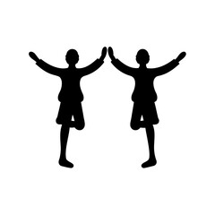 Two people mirroring each other balancing in a yoga like pose silhouette