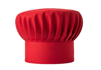 A vibrant red chef's hat, featuring a classic pleated design, stands out against a stark black background.