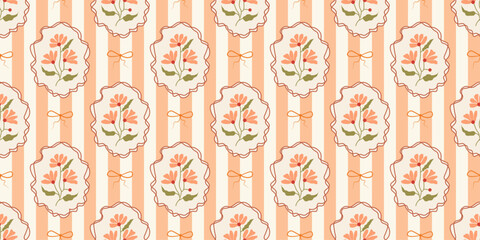 Seamless pattern on a striped background with hand drawn flowers in vintage frames and bow. Cottagecore coquette trendy print in fall colors. Vector illustration for textile, wrapping paper.