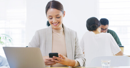 Fototapeta premium Smile, office or businesswoman texting with mobile for online feedback or message. Coworking, laptop or consultant reading smartphone for email notification, technology or news search in workplace