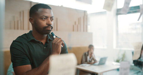 Thinking, man and glass for planning with ideas, schedule or insight for project management in...