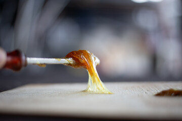 Workers applying rubber glue to the wood floor	