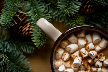 Cup of hot chocolate with marshmallow. Hot winter drinks in christmas environment. Cozy winter mood.