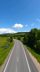 Fototapeta premium Winding Road Through Rural Landscape