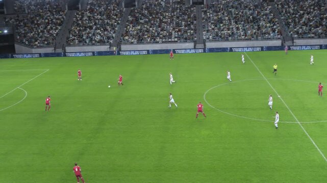 Soccer Football Championship Stadium with Crowd of Fans: Red Team Attacks, Scores Goal, Players Celebrate Tournament Victory. Sport Channel Broadcast Television Playback. High Angle Footage
