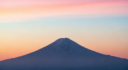 A breathtaking and tranquil scene featuring the iconic snow-capped Mount Fuji, a majestic volcanic peak, set against a stunning soft pastel gradient sky at dawn or dusk