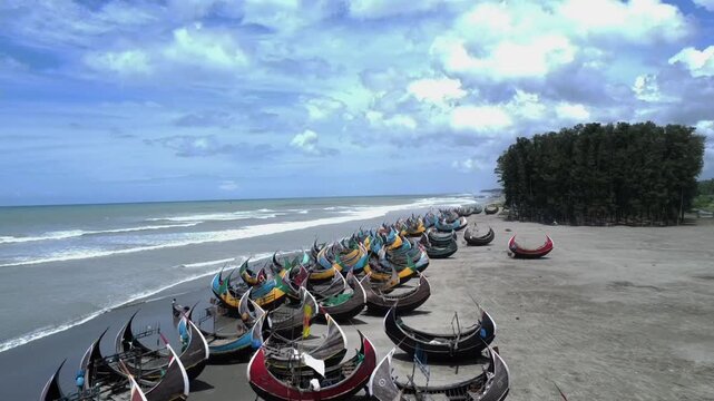 Traditional Wooden Fishermen's fishing boat, Teknaf Coxs bazar, Bangladesh. Colorful Wooden Fishing Boat On a Cox's Bazar Sea Beach With Blue Sky Background in Bangladesh.Beautiful Bangladesh Photo.