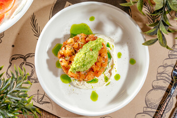 salmon tartare with avocado and cream sauce