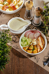 okroshka with potatoes, radishes and herbs