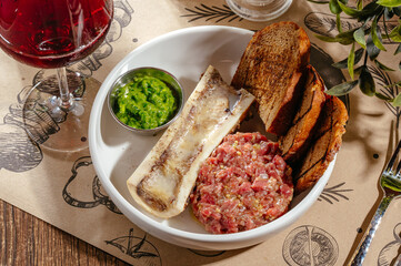 tartare with bone, croutons and sauce