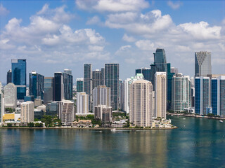 Obraz premium Aerial view of Brickell skyscrapers. Modern cityscape of downtown Miami. Panoramic Miamis skyline above the coastline. Brickell Key aerial view in Miami. Landscape of Miami. Miami Beach and Brickell.