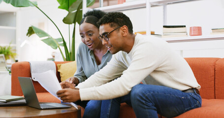 Documents, finance and laptop with couple on sofa in living room of home together for investment. Budget, computer and paperwork with happy people in apartment for portfolio review or savings
