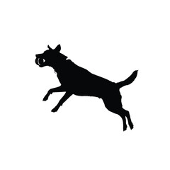 A black silhouette of a dog jumping in the air with its mouth open wide freely