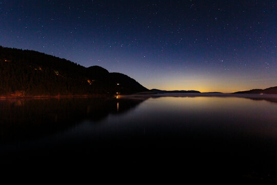 Star filled sky and bay at night, East Sound, Orcas Island, San Juan Islands, WA USA
