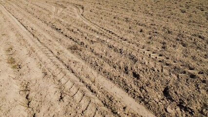 Overhead capture of a plowed field showing empty, ready soil