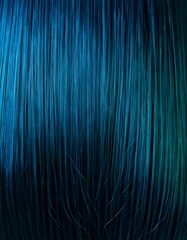 Close-up of vibrant blue and teal hair strands, showcasing a rich, smooth texture and a beautiful gradient of cool colors, perfect for beauty and fashion themes