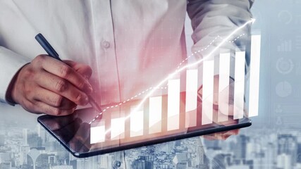 A business professional uses a tablet to analyze financial data, highlighting growth trends with a digital graph overlay in a contemporary office environment. Copula - Powered by Adobe