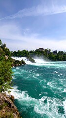 Picturesque waterfall cascading into turquoise water