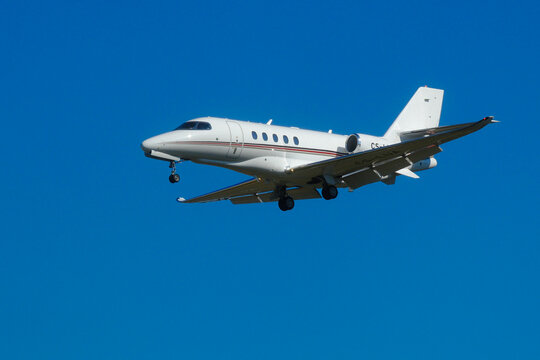 Geneva, Switzerland - june 25, 2025 : sign and logo on a Cessna Citation Latitude of NetJets landing at  Geneva Airport