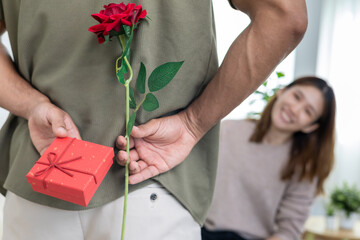 Happy husband seek and hide gift box for surprise wife. cute girl excited  gift box. birthday, Celebration, xmas, New year Festival, thank, Celebrate, Valentine's Day, Anniversary married