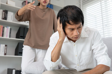 Fototapeta premium Divorce. quarrel between a husband and wife. Couples desperate and disappointing after marriage. Divorce document, upset and frustrated after conflict. Distrust, love problems, betrayals.