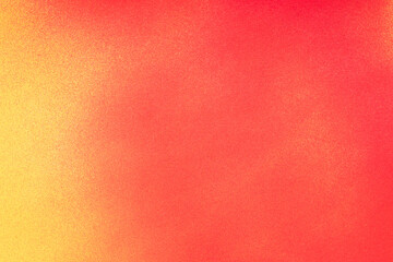 赤色と黄色のスプレー塗料で塗った背景	