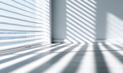 Obraz premium Sunlight streams through white blinds, casting shadows on a light-colored floor