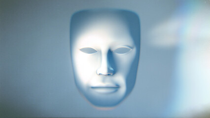 A theatrical style white mask dramatically lit with light sand shadow.