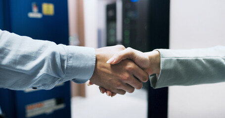 Handshake, deal and business people in office with meeting, welcome or greeting for finance negotiation. Partnership, agreement and financial manager shaking hands with client for investment contract