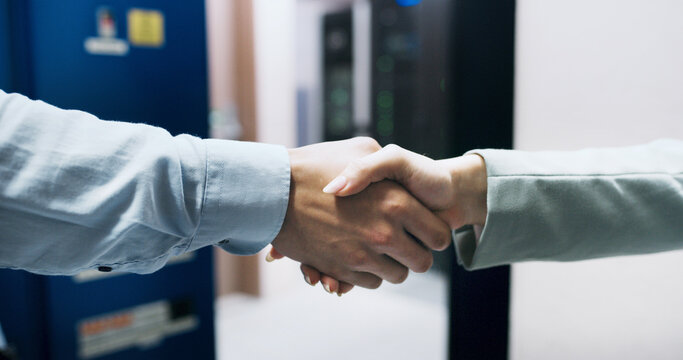 Handshake, deal and business people in office with meeting, welcome or greeting for finance negotiation. Partnership, agreement and financial manager shaking hands with client for investment contract