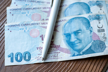Fototapeta premium White pen on Turkish money in close-up