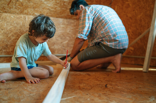 Family working together on house renovation and construction project