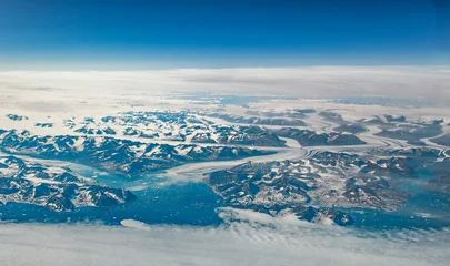 Selbstklebende Fototapeten Gletscher Aerial cockpit view of glaciers and mountains on Greenland coast  © Thomas