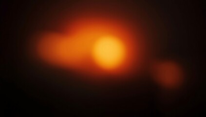 grainy colorful warm orange light leaks on black background with dust texture. abstract damaged scratched retro film analog effect for using over photos as overlay or screen filter