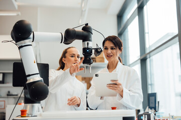 Scientists use robot arm for research in medical laboratory