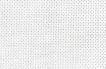 light gray fabric texture with hole pattern. background of perforated fabric