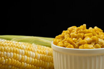 Close-Up Of Canned Corn In Bowl With Natural Fresh Corn.