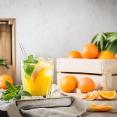 Fototapeta premium Refreshing Orange Cocktail with Mint and Ice