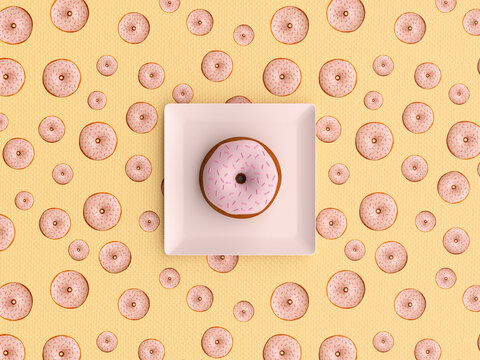 Pink donut with sprinkles on plate and patterned tablecloth top view