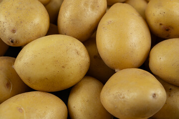 Fresh raw unpeeled potatoes close-up