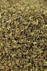 Dried Oregano Leaves Close-Up. Culinary Herb Background.