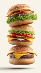 Stack of three cheeseburgers with sesame seed buns, lettuce, tomato, bacon, pickles, and melted cheddar – creative fast food concept photography