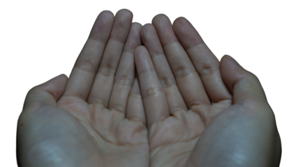 Pair of human hands held open in a cupping position against dark backdrop
